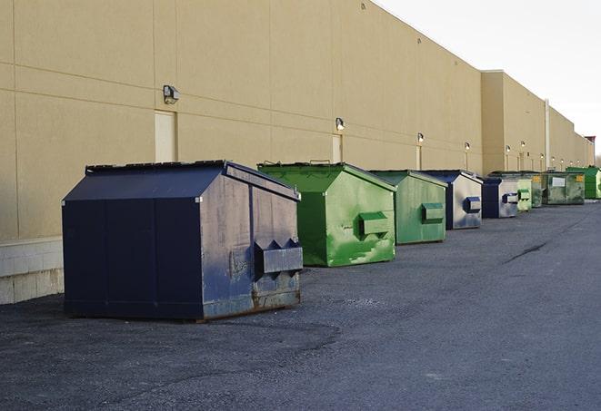 an aerial view of construction dumpsters placed on a large lot in Amherst, NY